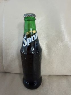 vintage 1994 Sprite lemon-lime soda bottle in a 8 FL OZ glass container.