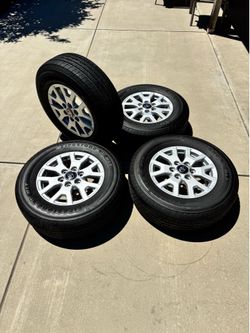 4 Toyota OEM-style 17” alloy wheels with Firestone tires