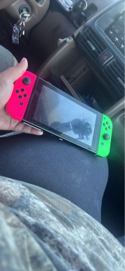 Nintendo Switch with Neon Pink and Green Joy-Cons