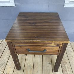Dark wood medium size side table with drawer a little scratched