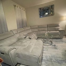 Selling two high-quality furniture pieces in great condition for the couch 1600 AND  600$ for TV stand :