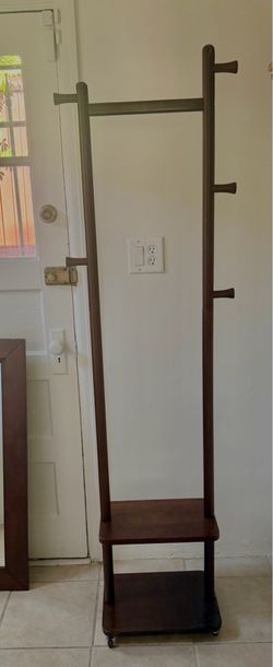 Clothing rack with double tier shelf, hooks on wheels