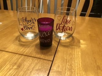 Wine glasses with candle think Valentine’s Day