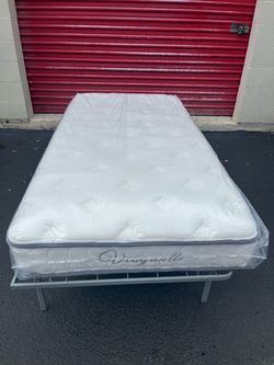 Brand new twin-size mattress in plastic
