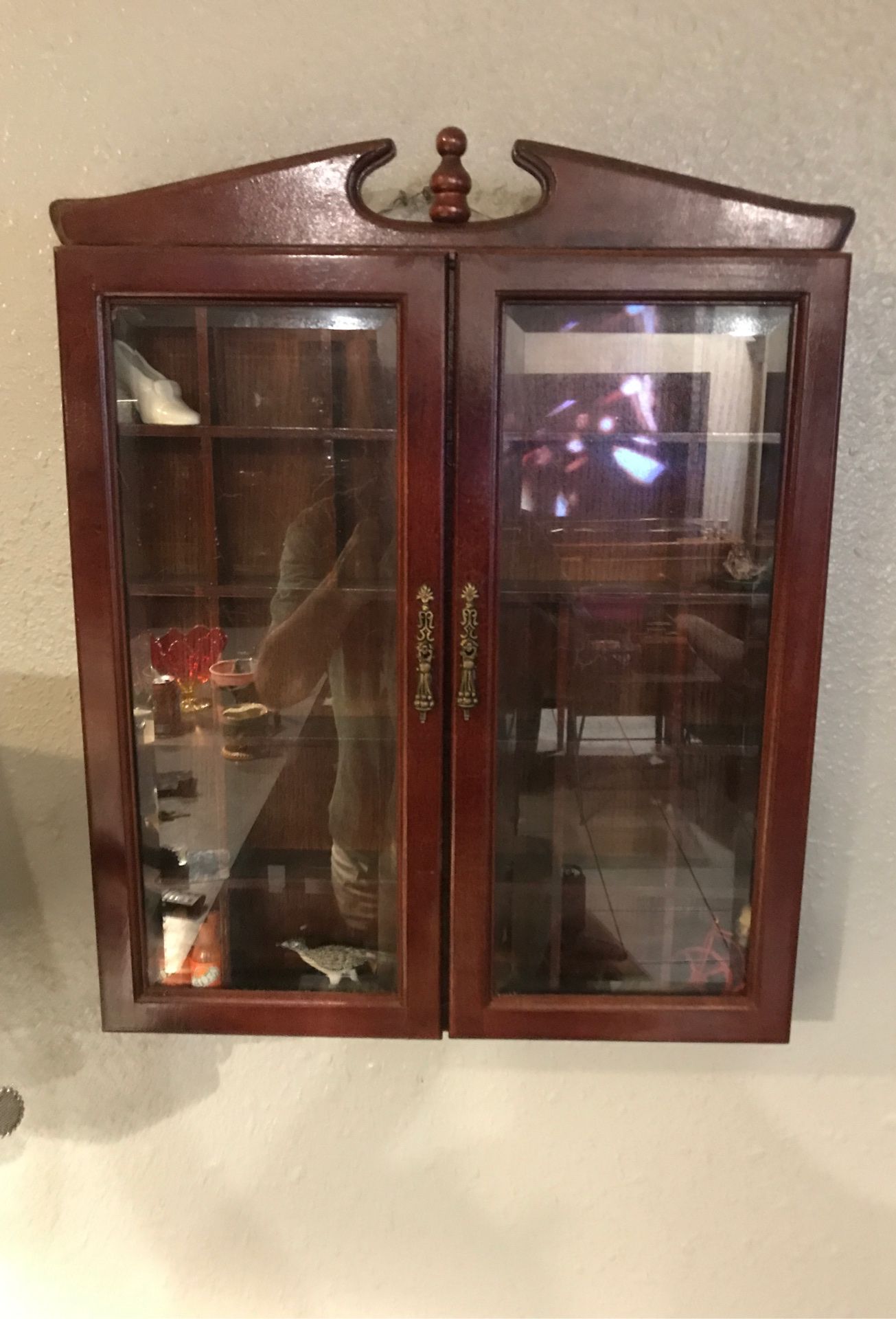 20 inches tall by 16 inches wide antique display cabinet