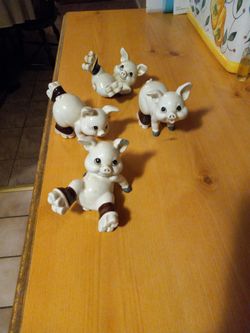 1960 Roller Skating  Minture Pig Statuettes 