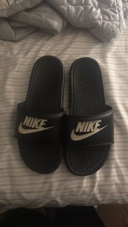 White and black Nike slides