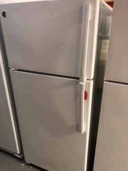 Used GE top and bottom fridge. 1 year warranty