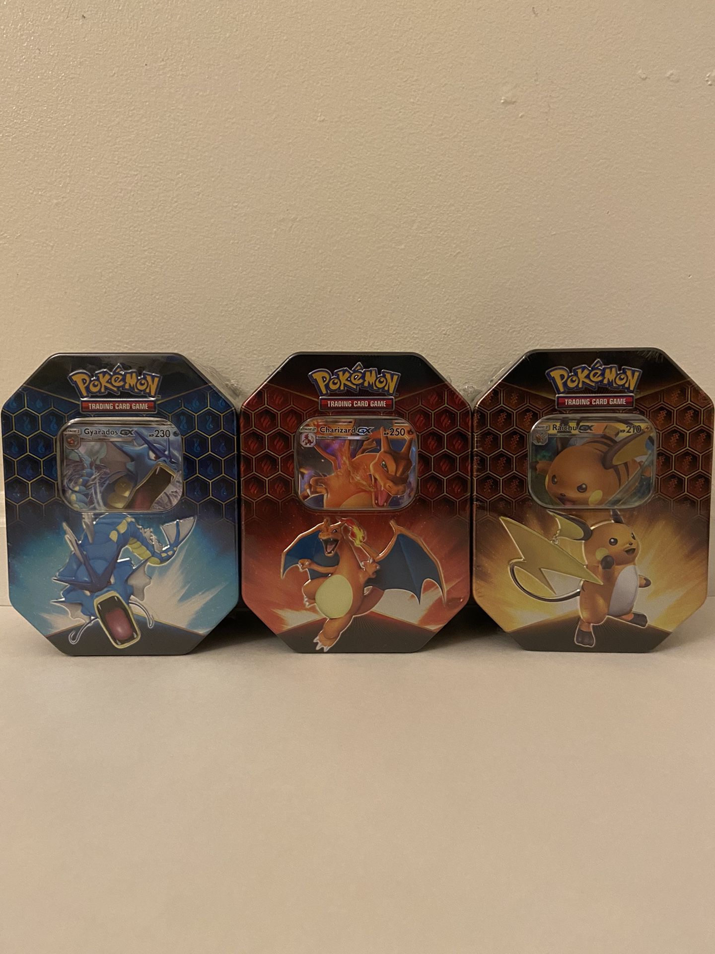 Pokemon Hidden Fates Tin Set of 3 CHARIZARD GYARADOS RAICHU TCG 12 BOOSTER PACKS