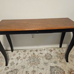 Table with a narrow tabletop