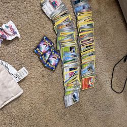 over 200 pokemon cards and 2 battle deck boxes