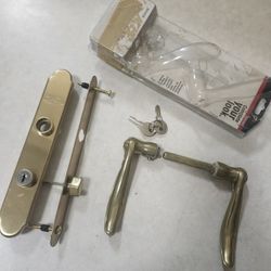 STORM DOOR Larson QuickFit Series door handleset in brass. 