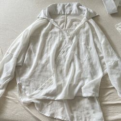 Women’s white oversized wrap blouse with a front pocket