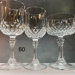 Lot of (11) pieces. Cristal D'Arques.   Long champ.  Durand.  5- Water/Tea 7 1/8 “ tall. 8oz.  4- Wine Glass 6 1/2” tall. 5 3/4 OZ 2-  Champagne/Tall 