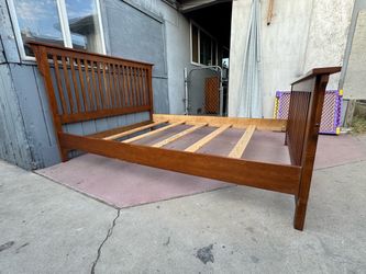 Solid wood queen bed frame in very good condition
