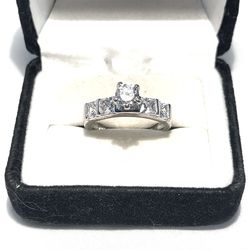 Brand new .925 silver wedding ring with cubic zirconia CZ diamonds. Size 7.5