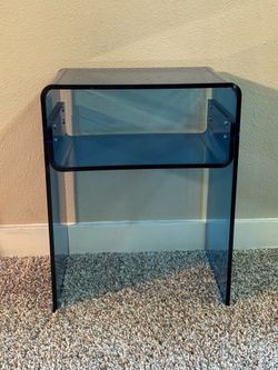 Blue acrylic side table.