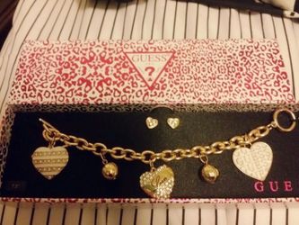 BRAND New Gold charm bracelet and earing set by Guess