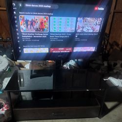 42 inch HDTV plasma TV and TV stand mounted with bottom drawer (MAKE OFFER NOT FIRM ON PRICE)