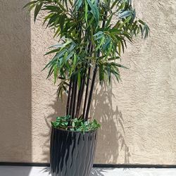 Beautiful, realistic-looking bamboo plant in a glossy, heavy ceramic planter.