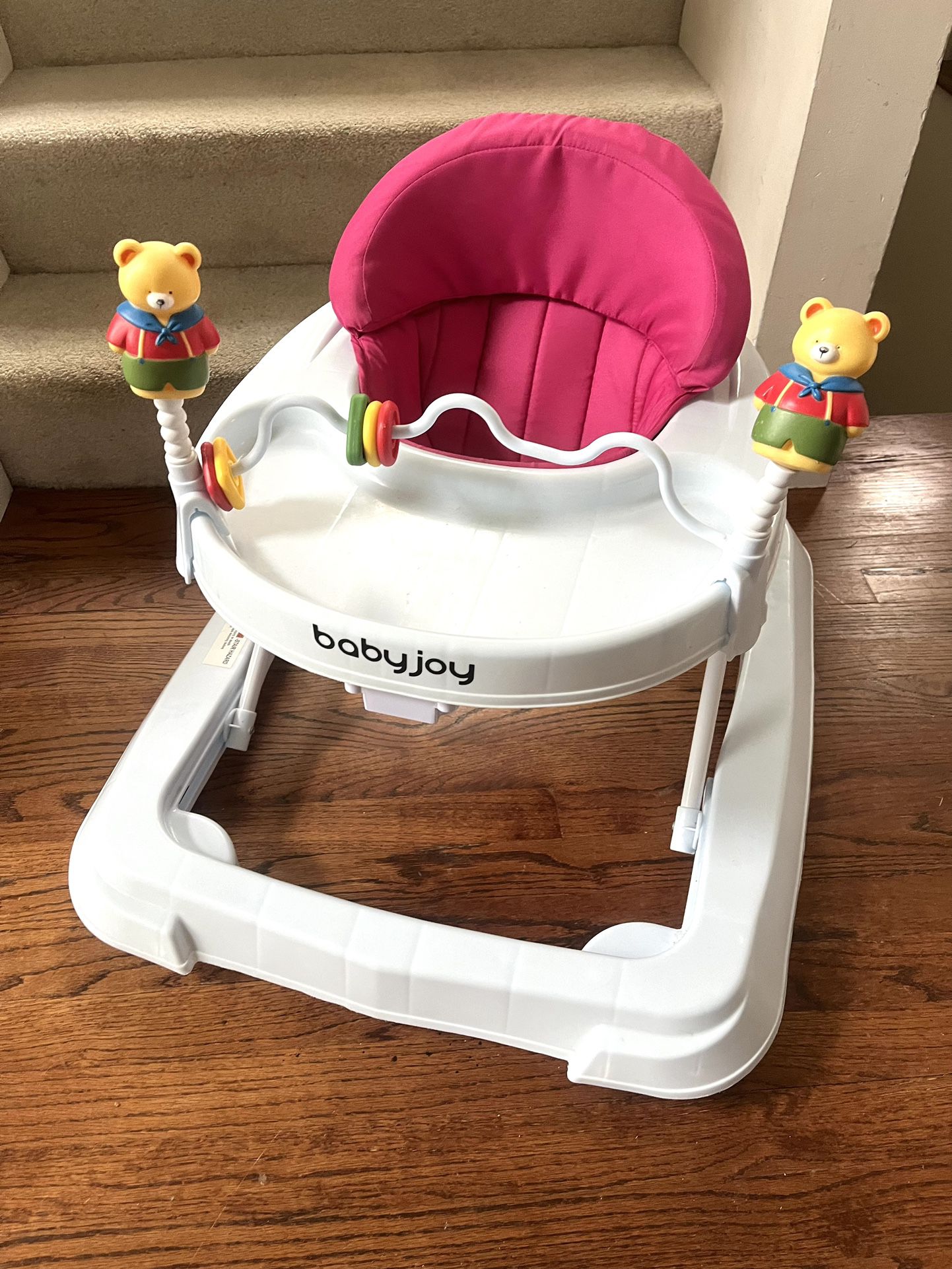 Baby Joy Walker with adjustable height, foldable with soft padded seat and a toy bar