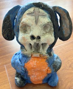 Skeleton wearing dog costume