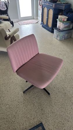 Pink armless swivel chair