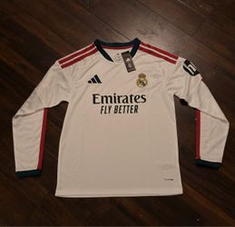 Adidas Real Madrid home shirt with stripes on shoulders and sleeves