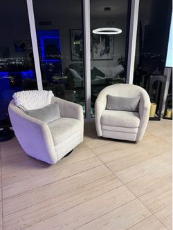 Pair of Cream Swivel Accent Chairs