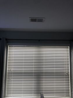 White, 2” faux wood blinds with valence included. Previously installed by builder. 72” wide, cut to 71”. Cords to open and close the blinds on the le