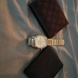Gucci wallets and Hugo Boss watch
