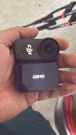 Dji osmo mini camera at table to chest magnet or hat clip