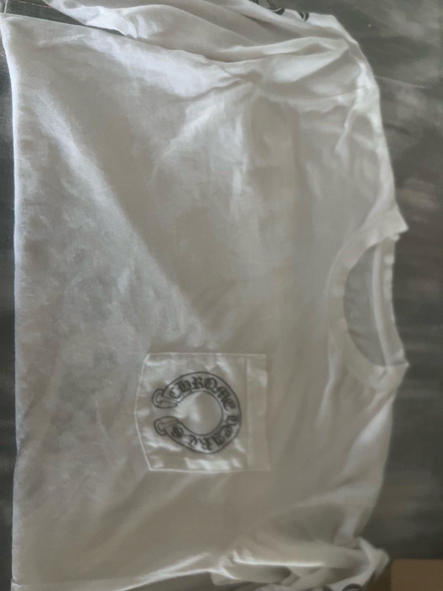 authentic chrome hearts white long sleeve size medium men’s is a stained but it’s like a gray transparent stain
