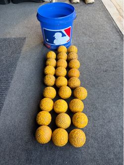 Yellow dimple pitching machine baseballs