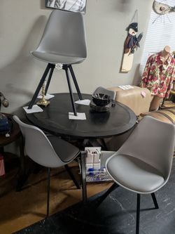 Modern round black table with 4 chairs