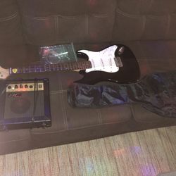 Electric Guitar With Case And Amp . Speaker