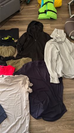 Men’s tshirts 4 hoodies 12 t shirts one flannel size large / x large and one blue sweat shirt 4 x look like X-Large
