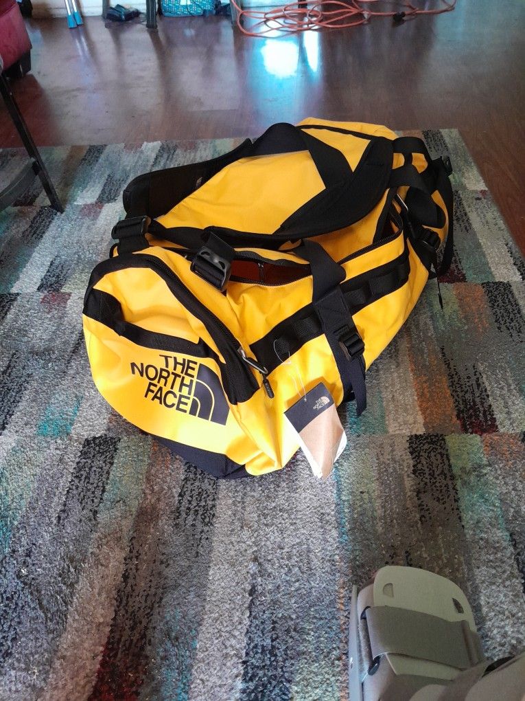 Yellow And Black North Face Duffle Bag