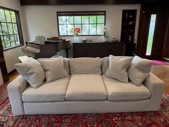 Light grey three-cushion sofa
