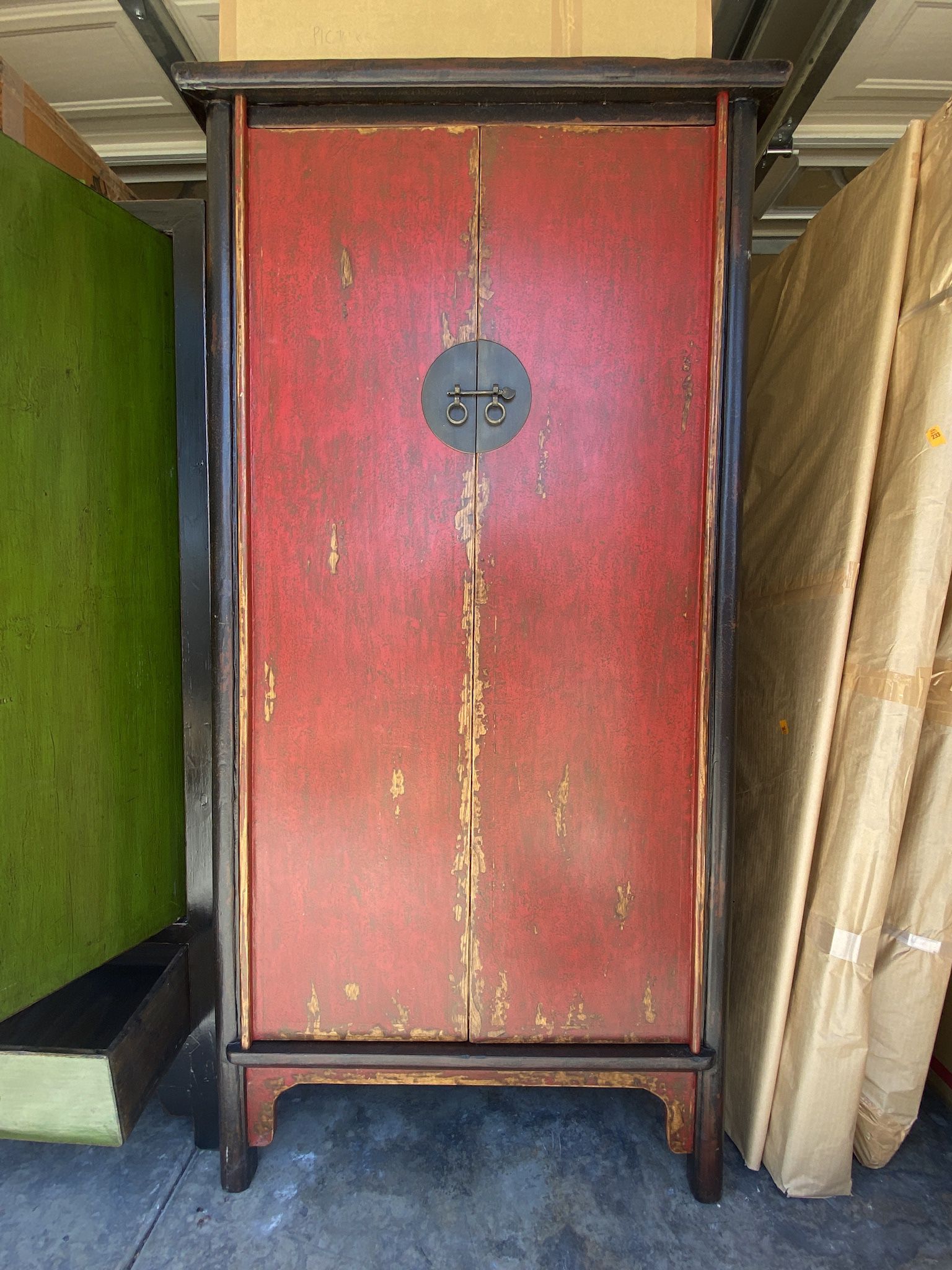 Antique red lacquered wedding cabinet armoire wardrobe, with large medallion, 2 doors and 2 drawers