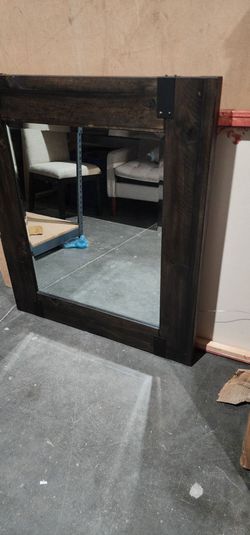 Decorative dark wooden mirror