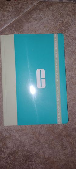 Clinique notebook with a teal and cream color scheme