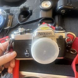 2 35mm Cameras With Lenses And Other Equipment 
