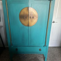 Oriental Armoire with gold accents 
