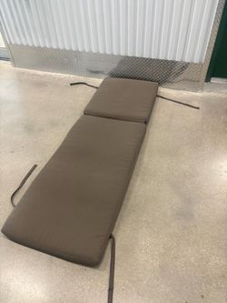 Light brown thick lounge chair cushion with zipper for washing. 24 “ wide , 74 “ long, 4” thick