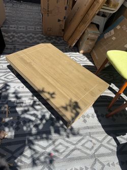 Brand new asking $45  Wooden coffee table has a light brown finish and a planked top design. The rectangular table has sturdy block legs.