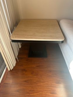 Black chairs and beige table top