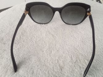 Crossed sunglass DG