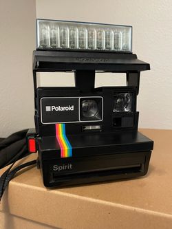 Vintage Polaroid 600 Spirit camera with rainbow stripe and Flash Bar