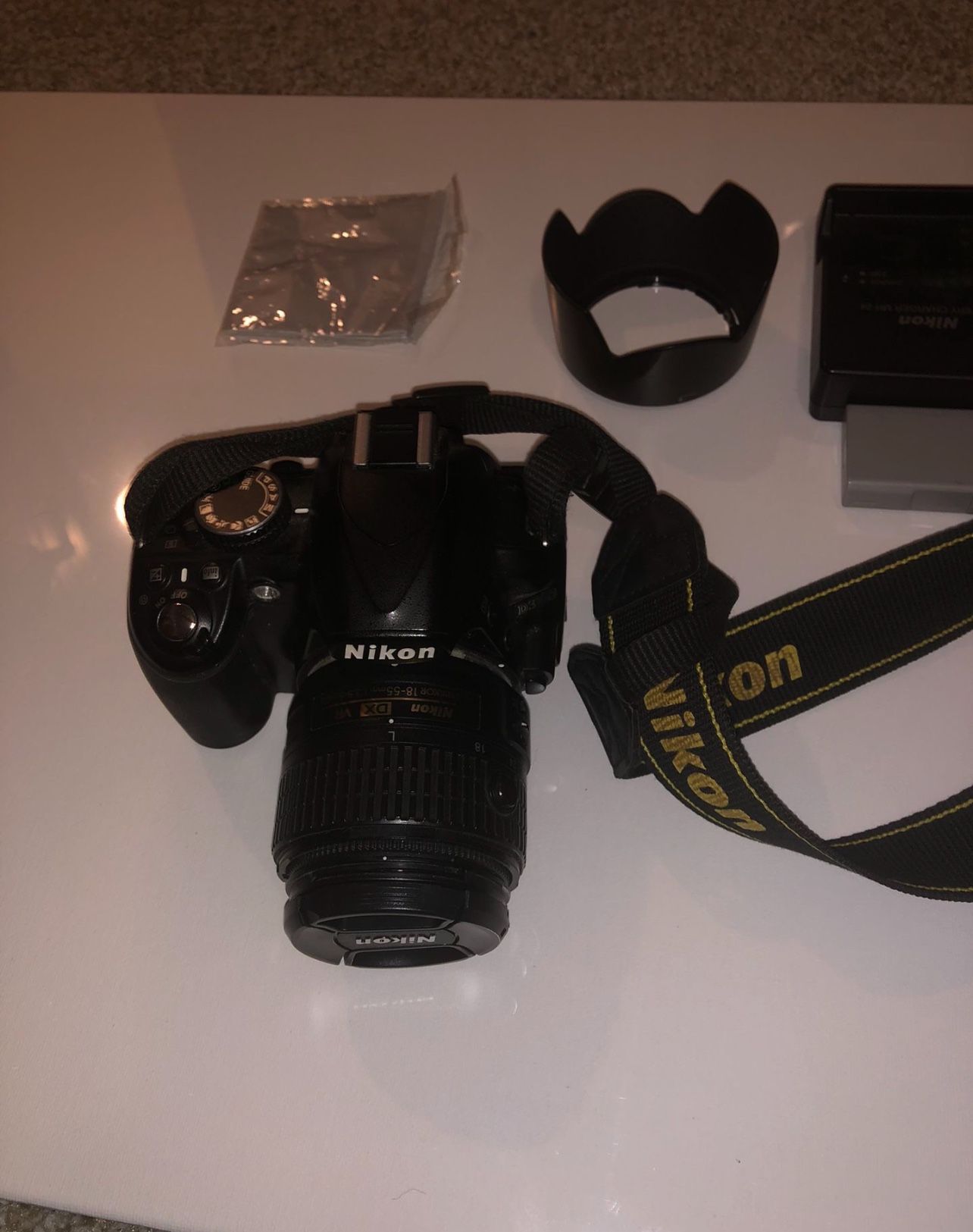 Nikon D3100  Digital camera  and holder with Charger and Extra battery works great no problem 